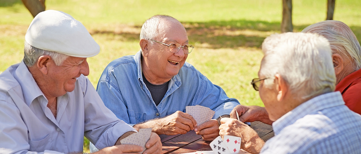 Residents at Canterbury enjoying a lively card game outdoors